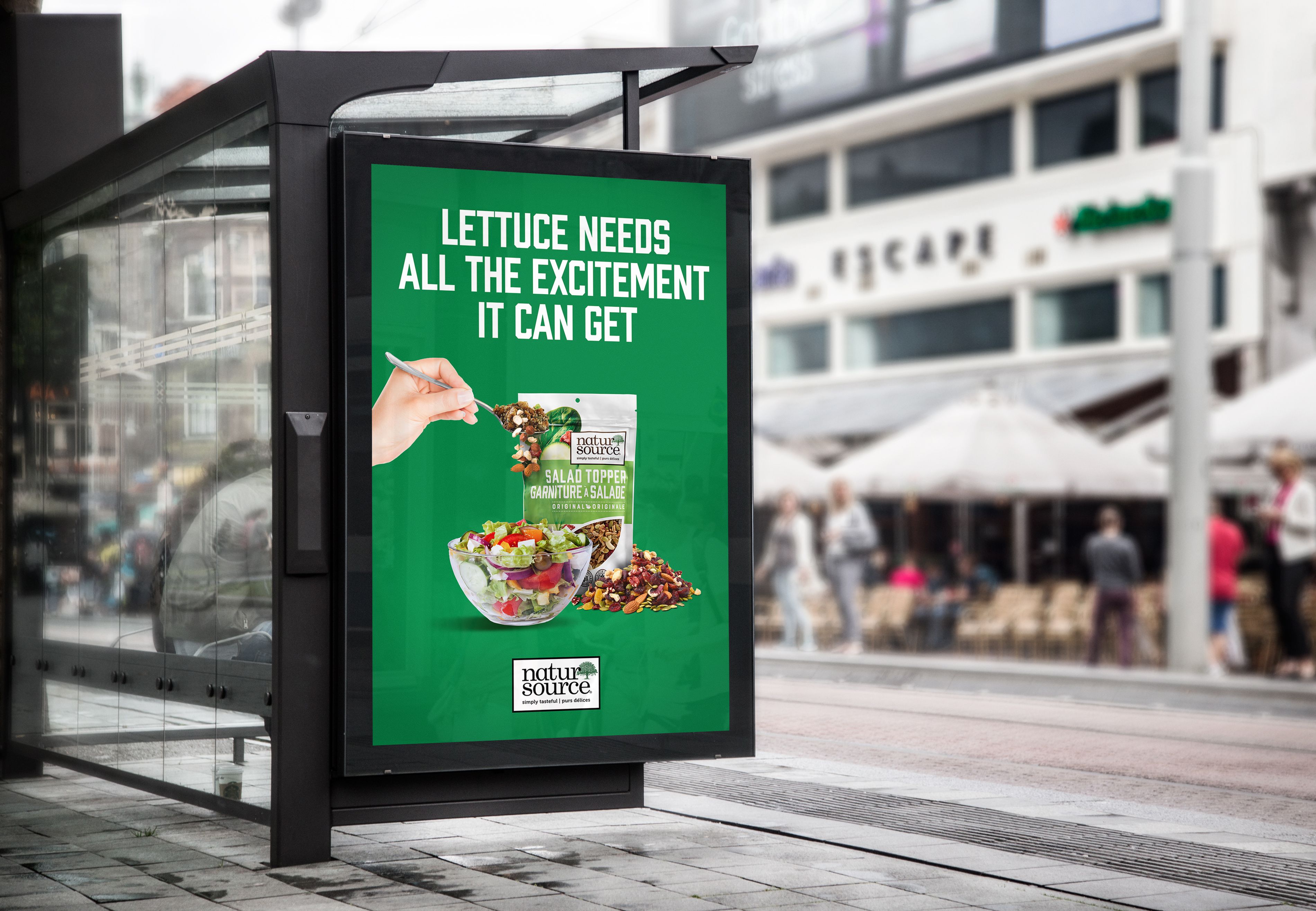 Bus stop ad showcasing naturSource's Salad topper